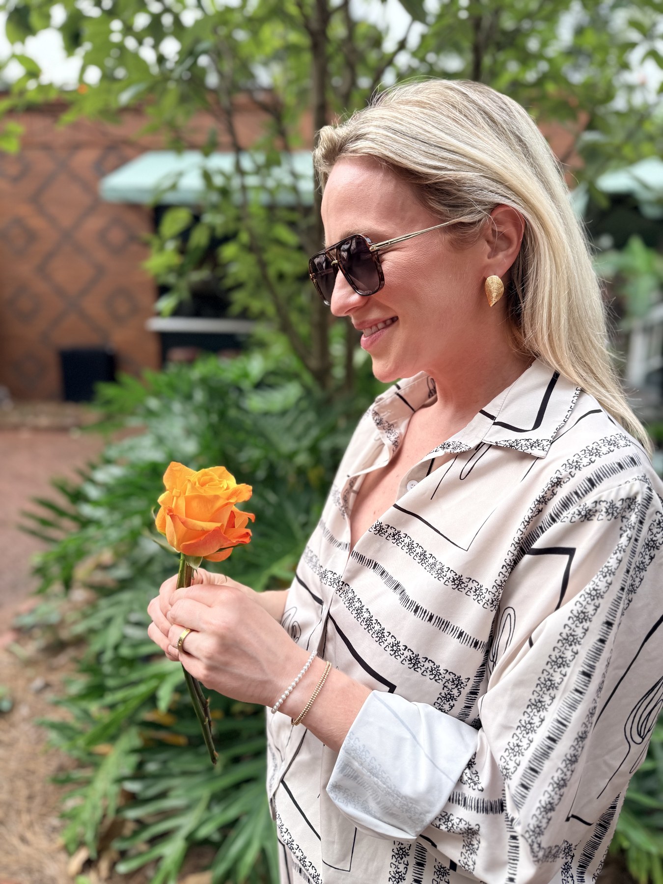 Anne Kenny, founder and creative director of Heirloom South, arranging flowers in her New Orleans studio.